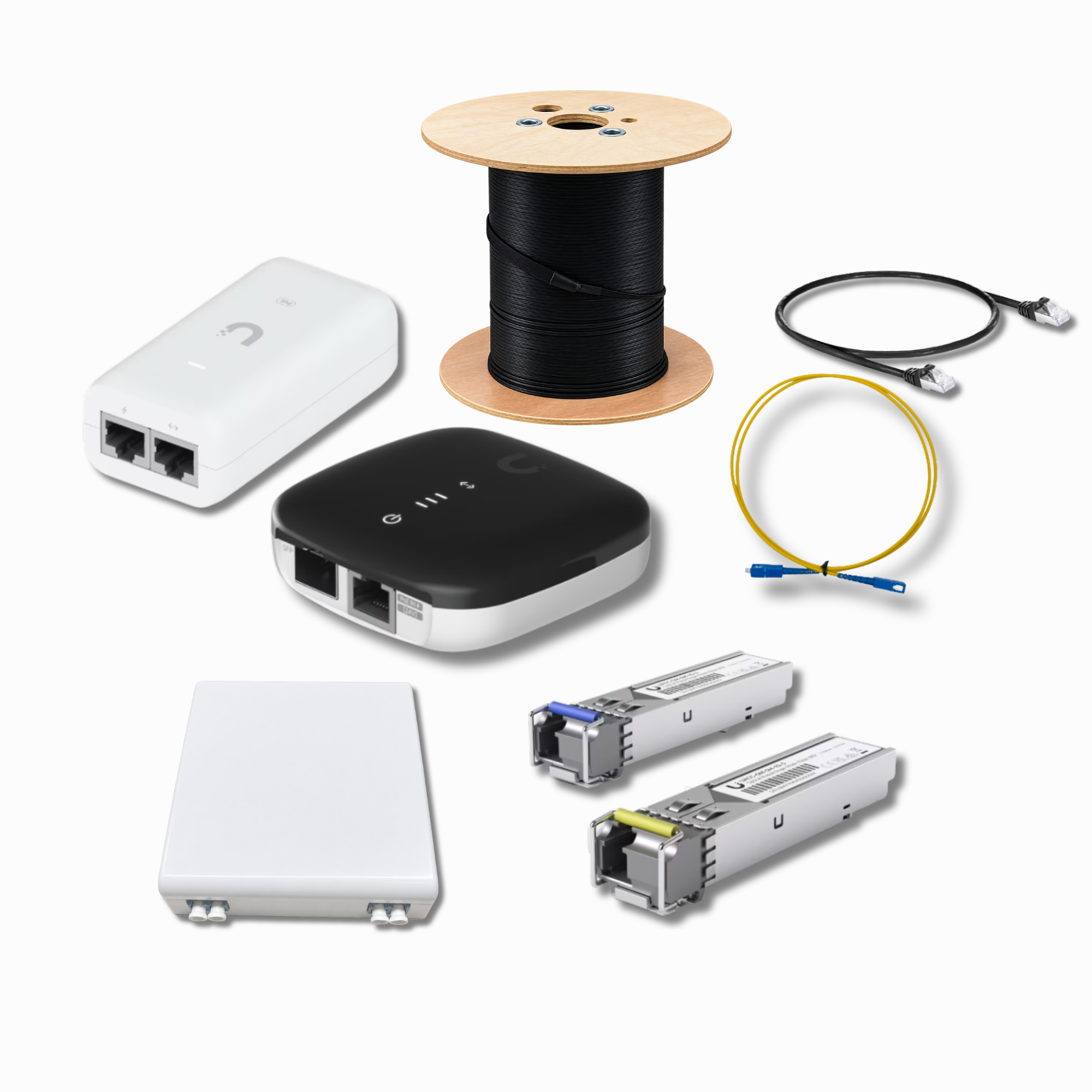 Klarotech kit components: outdoor fiber reel, media converter, power adapter, terminal box, fiber modules, and yellow fiber and black Ethernet patch cords